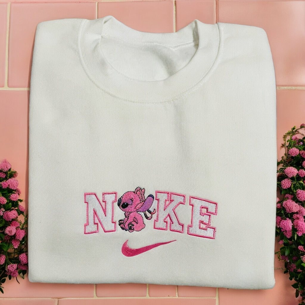 Embroidered Stitch and angel sweatshirt by Sweet Vision LLC, featuring cute stitches and angel design on cozy fabric.