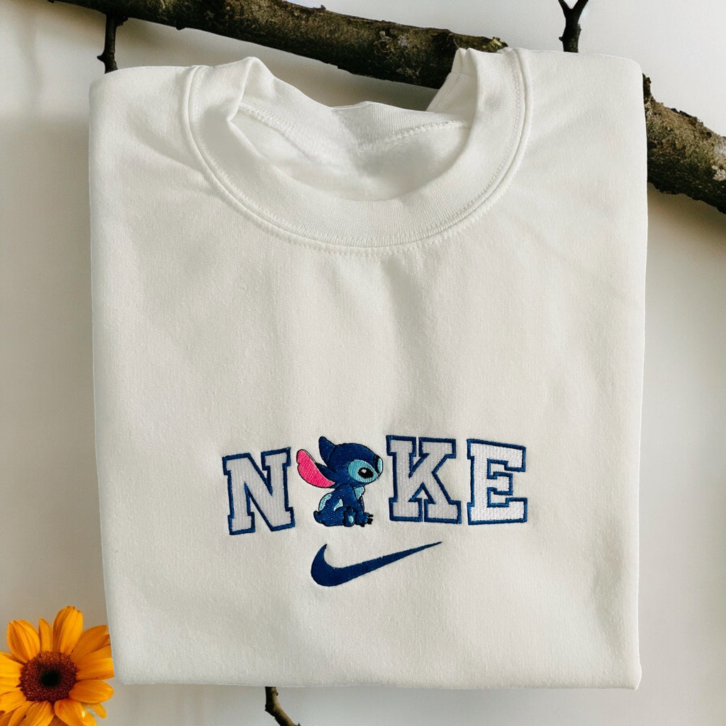 Embroidered Stitch and angel design sweatshirt from Sweet Vision LLC, cozy and cute for fans, featuring detailed embroidery on soft fabric.