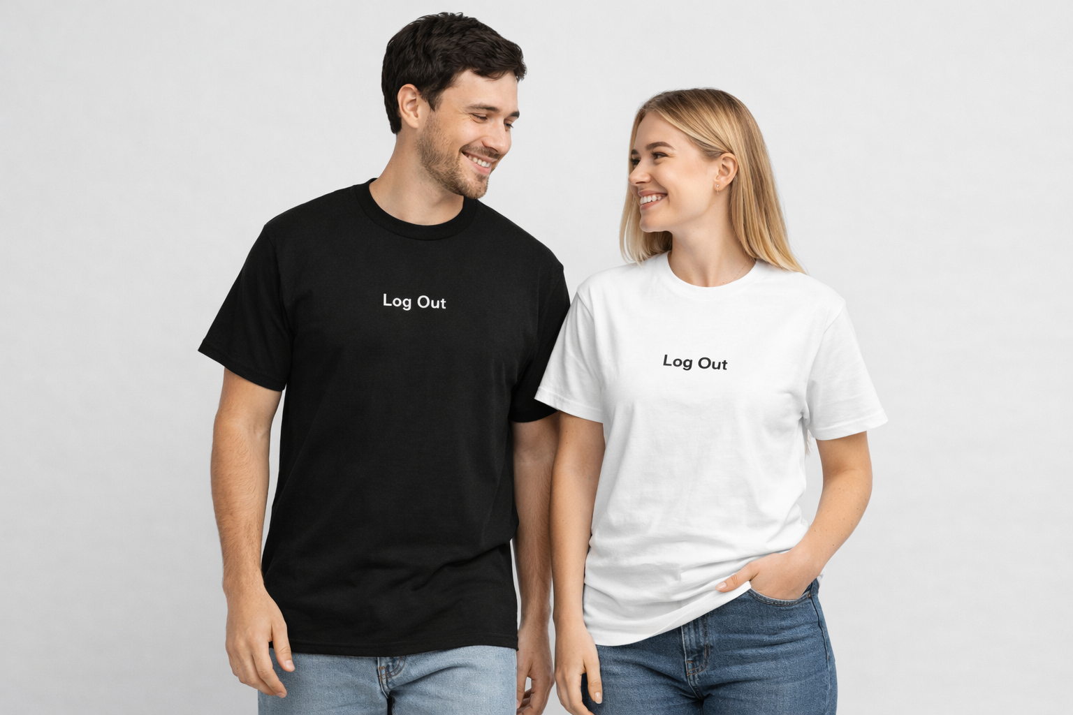 Couple wearing minimalist “Log Out” T-shirts, man in black and woman in white, standing together on a clean light gray background.