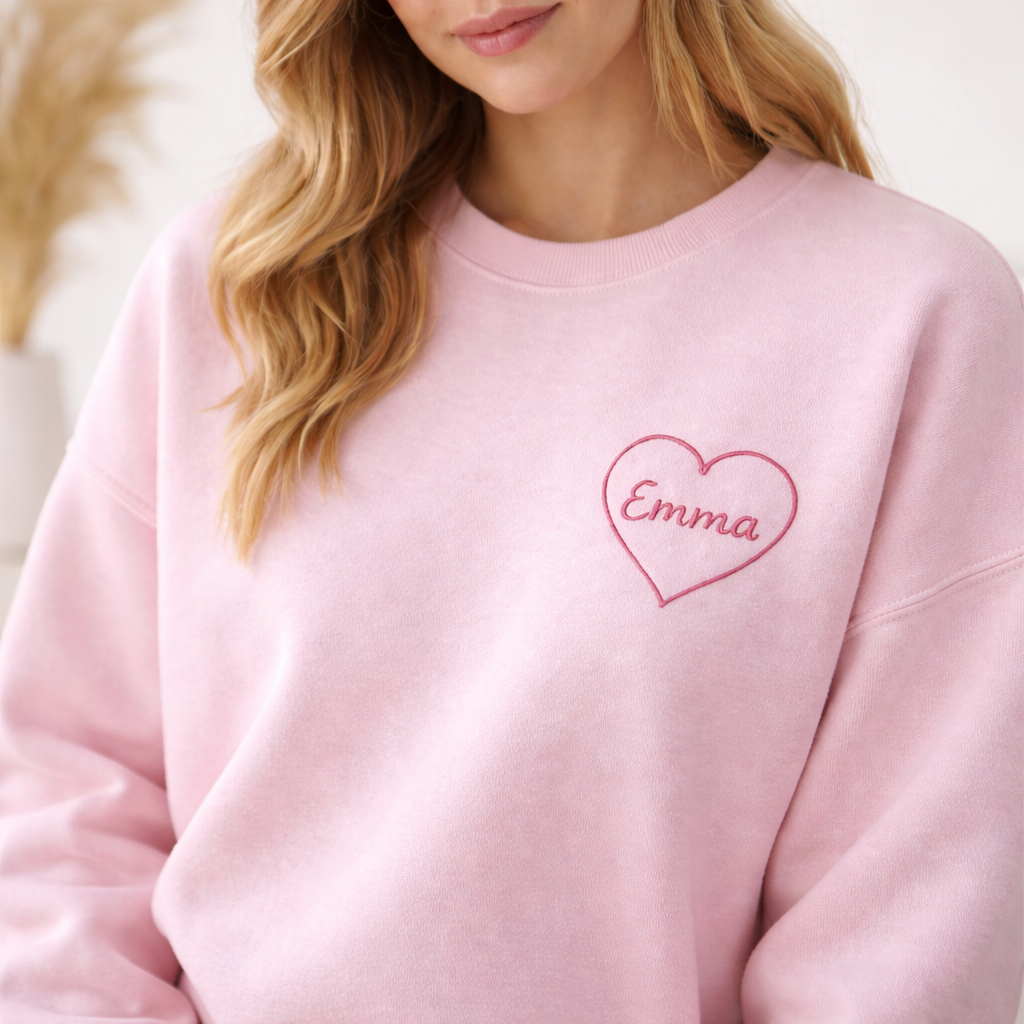 Personalized heart embroidered sweatshirt with custom name on light pink crewneck